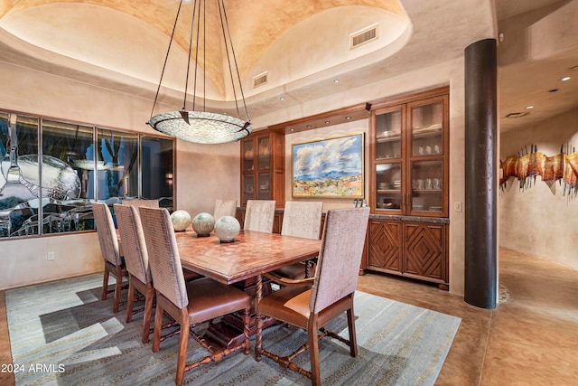 dining room featuring a raised ceiling