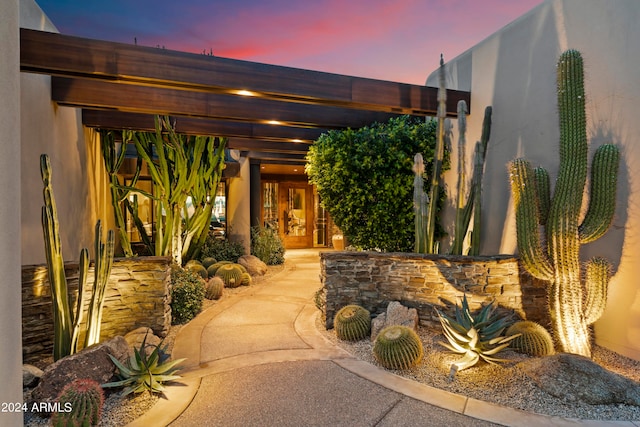 view of patio terrace at dusk