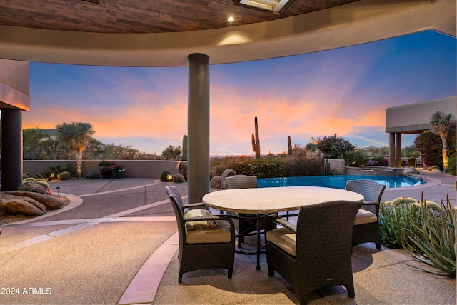 view of patio terrace at dusk