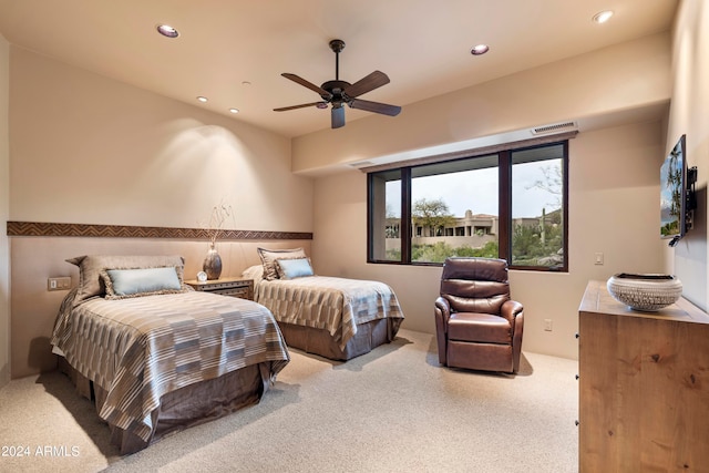 bedroom with light carpet and ceiling fan