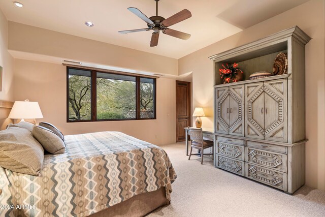 carpeted bedroom with ceiling fan