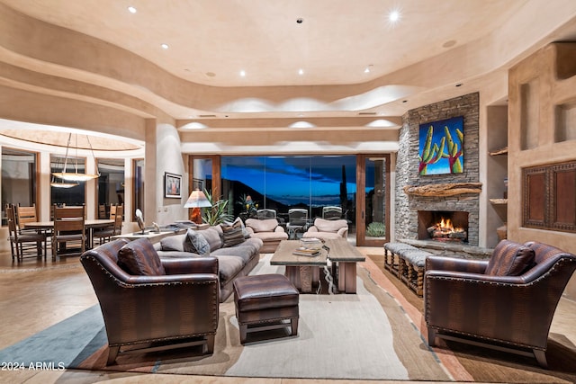 tiled living room featuring built in features and a fireplace