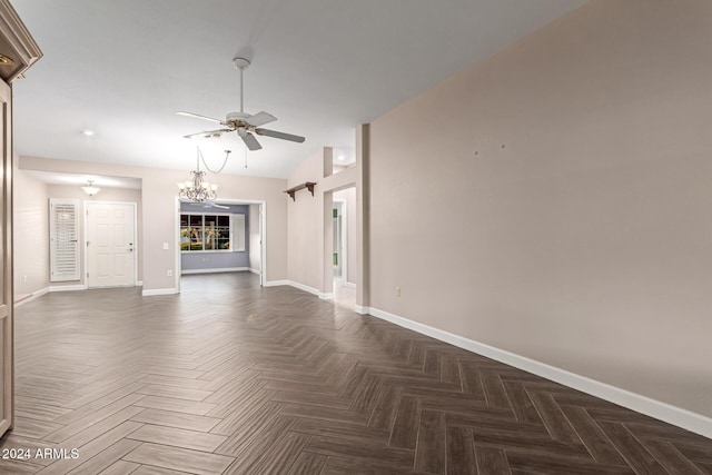 unfurnished living room featuring ceiling fan with notable chandelier, dark parquet floors, and lofted ceiling