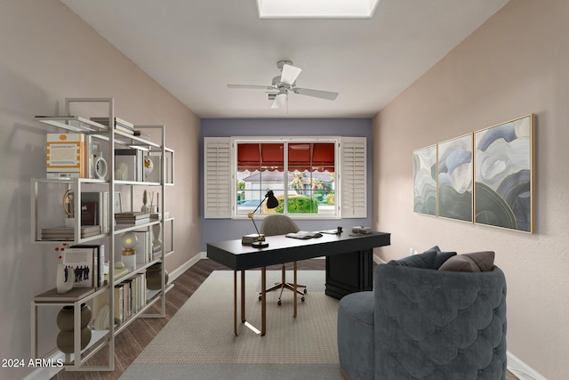 office area featuring ceiling fan and dark wood-type flooring