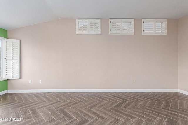 basement featuring parquet flooring