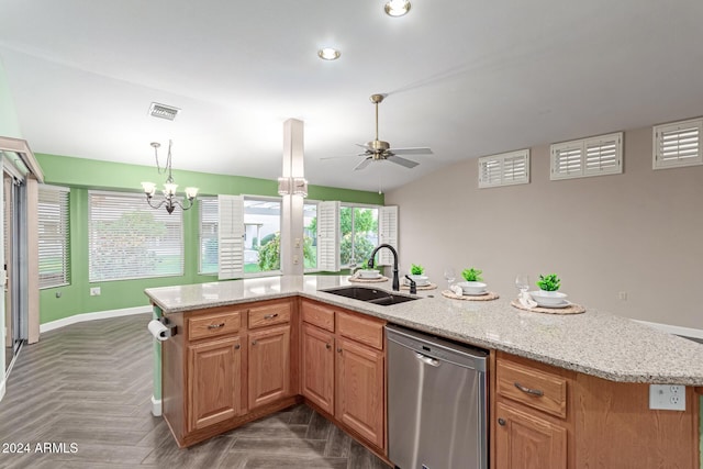 kitchen featuring sink, ceiling fan with notable chandelier, stainless steel dishwasher, and a center island with sink