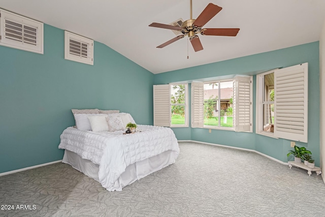 carpeted bedroom featuring ceiling fan and lofted ceiling