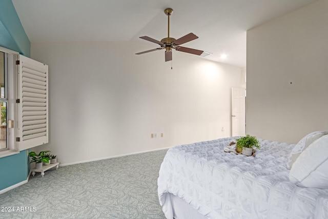 bedroom featuring carpet, ceiling fan, and lofted ceiling