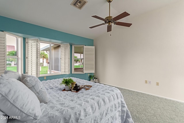 carpeted bedroom featuring ceiling fan and lofted ceiling