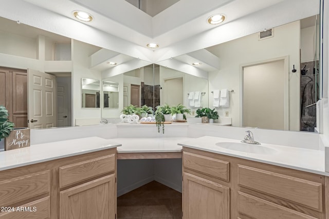 bathroom featuring tile patterned flooring and vanity