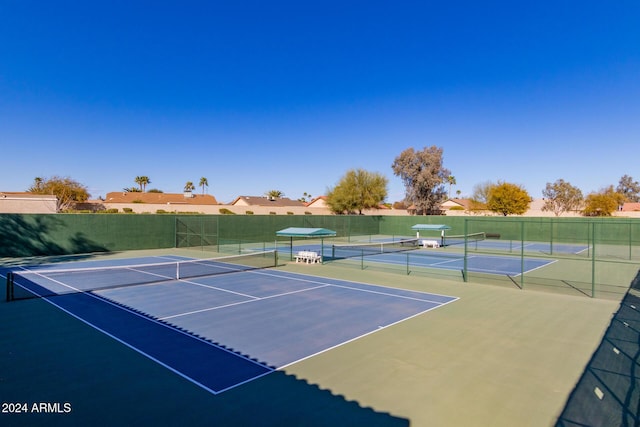 view of sport court with basketball hoop