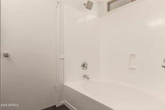 full bathroom with wood finished floors and shower / washtub combination