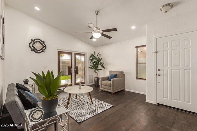 living room with baseboards, ceiling fan, dark wood-style floors, french doors, and lofted ceiling