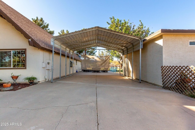 view of parking / parking lot with a carport