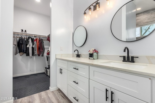 bathroom with hardwood / wood-style floors and vanity