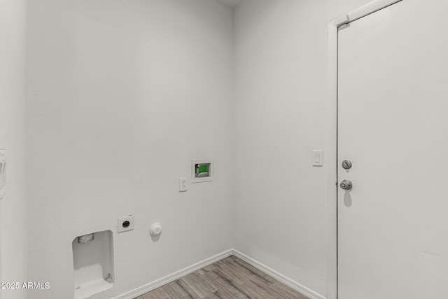 laundry room with hookup for an electric dryer, laundry area, washer hookup, light wood-style floors, and hookup for a gas dryer