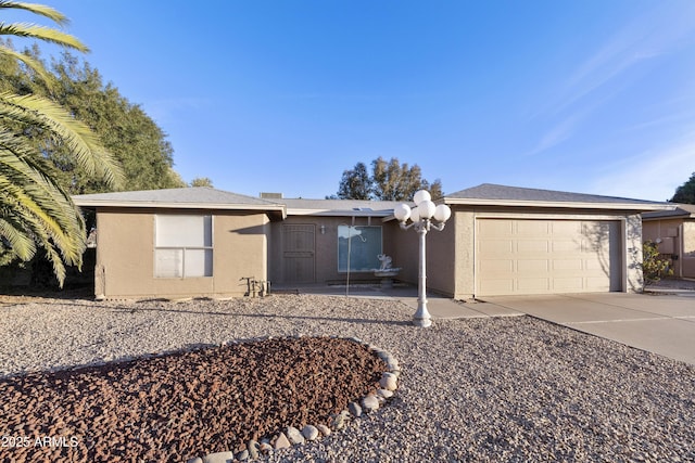 single story home featuring a garage