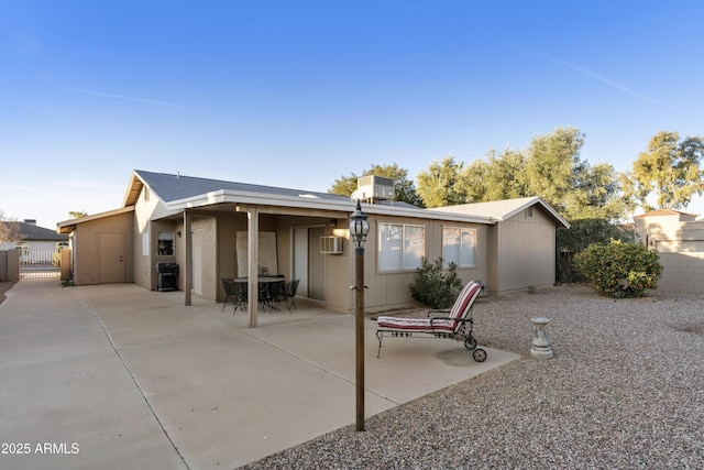 rear view of property featuring a patio area