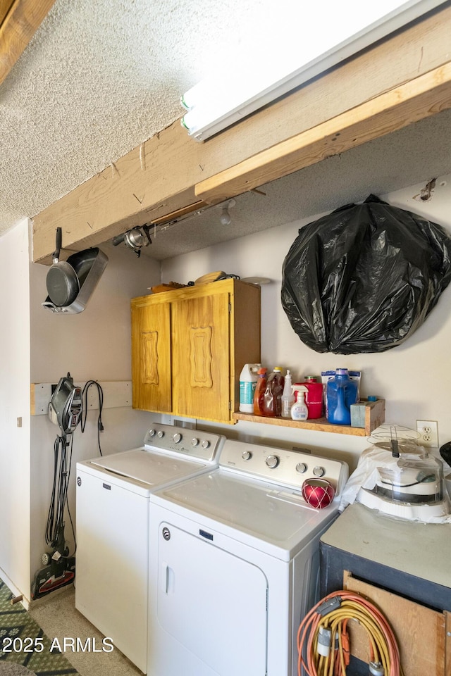 laundry room with washing machine and clothes dryer