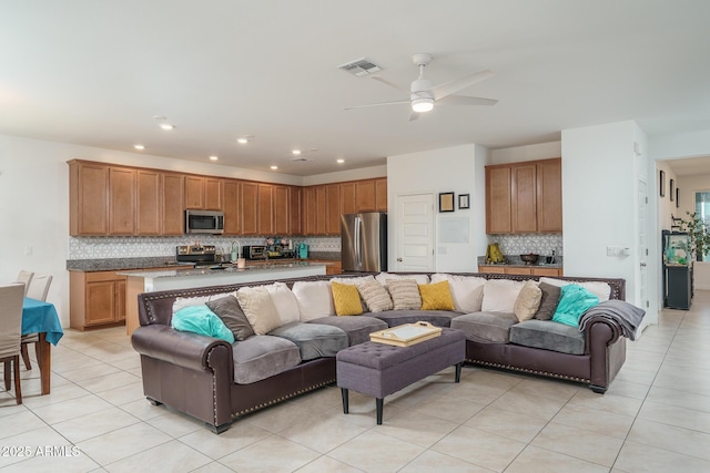 living room featuring recessed lighting, visible vents, ceiling fan, and light tile patterned floors