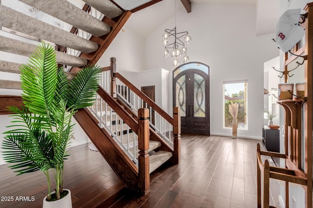9921 E Doubletree Ranch Rd, Scottsdale, AZ 85258 - foyer featuring stairs, beamed ceiling, high vaulted ceiling, dark wood finished floors, and a chandelier