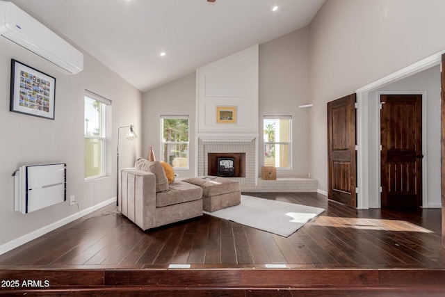 9921 E Doubletree Ranch Rd, Scottsdale, AZ 85258 - living area featuring a wall mounted AC, dark wood-type flooring, a brick fireplace, and high vaulted ceiling