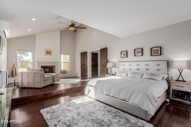 9921 E Doubletree Ranch Rd, Scottsdale, AZ 85258 - bedroom with hardwood / wood-style flooring, a brick fireplace, recessed lighting, high vaulted ceiling, and a ceiling fan