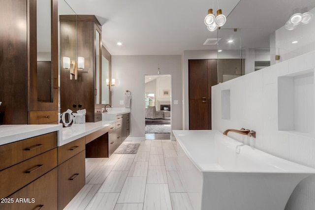 9921 E Doubletree Ranch Rd, Scottsdale, AZ 85258 - full bathroom featuring a freestanding tub, vanity, and recessed lighting