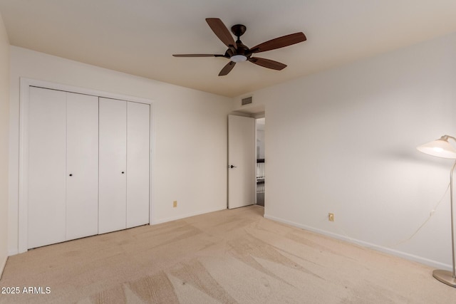 9921 E Doubletree Ranch Rd, Scottsdale, AZ 85258 - unfurnished bedroom with carpet flooring, a closet, and ceiling fan