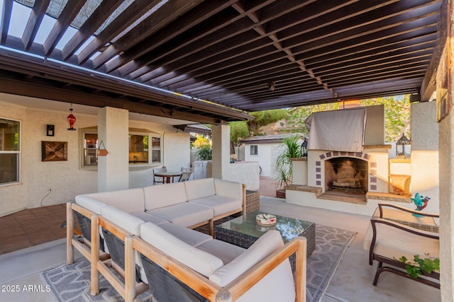 9921 E Doubletree Ranch Rd, Scottsdale, AZ 85258 - view of patio with an outdoor living space with a fireplace
