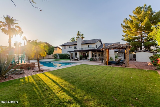 9921 E Doubletree Ranch Rd, Scottsdale, AZ 85258 - rear view of house featuring a patio area and an outdoor pool