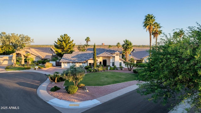 9921 E Doubletree Ranch Rd, Scottsdale, AZ 85258 - mediterranean / spanish house with driveway, stucco siding, a front lawn, and a garage