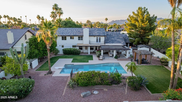 9921 E Doubletree Ranch Rd, Scottsdale, AZ 85258 - rear view of property featuring a gazebo, a fenced backyard, a patio area, an outdoor pool, and an outdoor living space