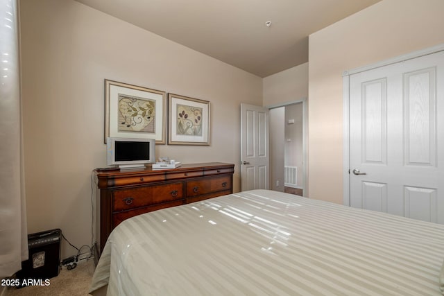 bedroom with carpet floors and visible vents