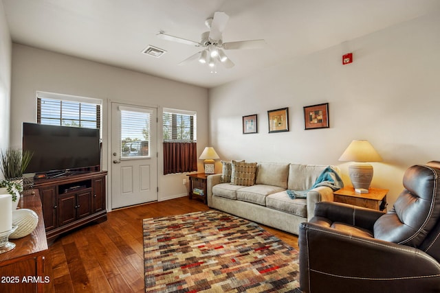 living room featuring visible vents, ceiling fan, and hardwood / wood-style floors