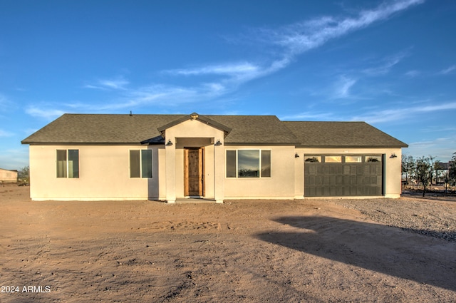 ranch-style home with a garage