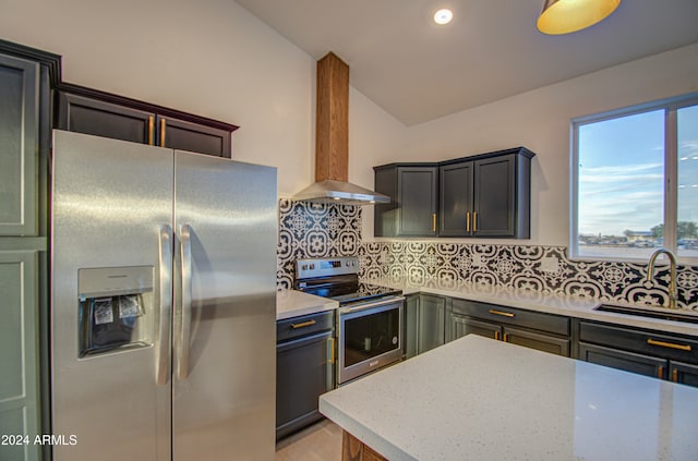 kitchen with backsplash, wall chimney range hood, sink, light stone countertops, and appliances with stainless steel finishes