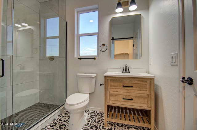 bathroom with tile patterned flooring, vanity, toilet, and walk in shower