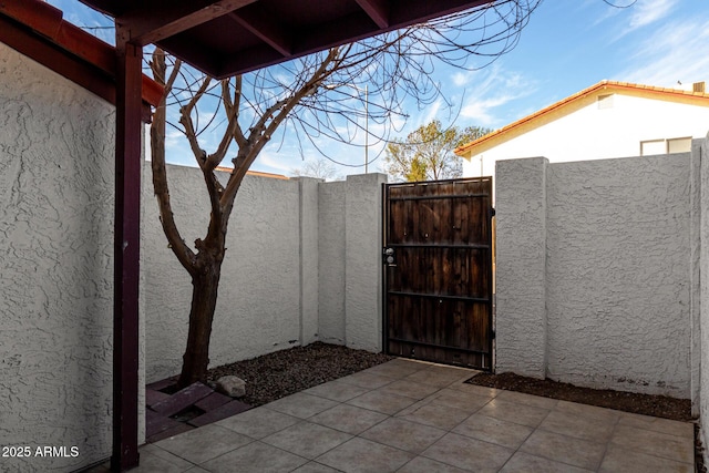 view of gate with fence