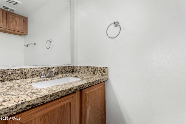 bathroom with visible vents and vanity