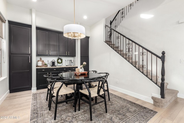 dining area with light hardwood / wood-style flooring