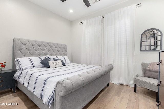 bedroom featuring ceiling fan and light hardwood / wood-style flooring