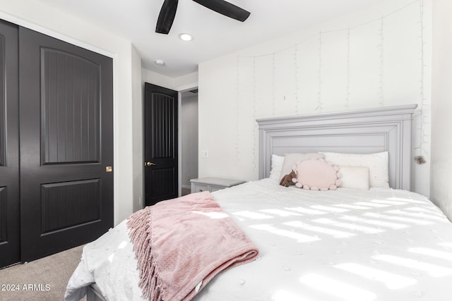 bedroom with carpet flooring, ceiling fan, and a closet