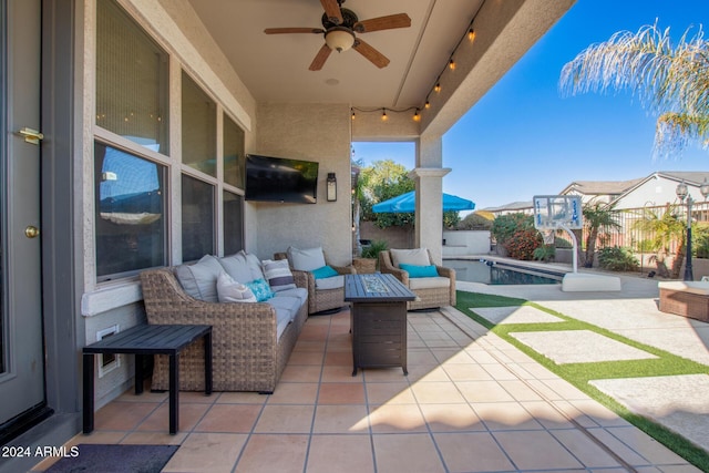 view of patio with outdoor lounge area, ceiling fan, and a fenced in pool