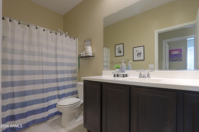 bathroom featuring vanity, toilet, and tile patterned floors