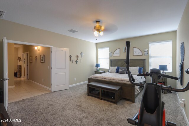 bedroom featuring ceiling fan and light colored carpet