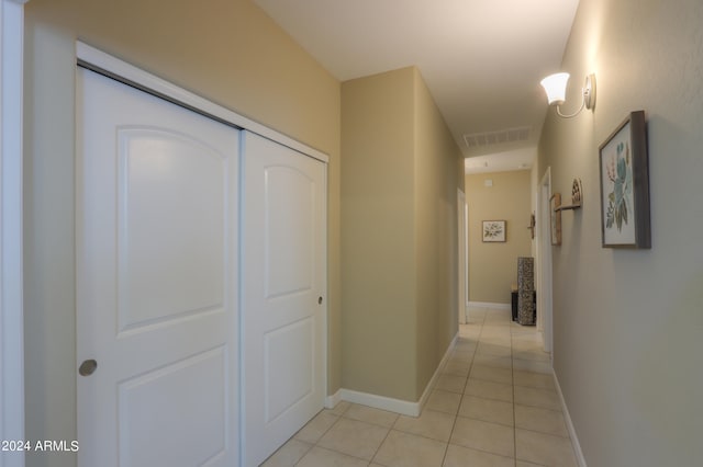 corridor featuring light tile patterned floors