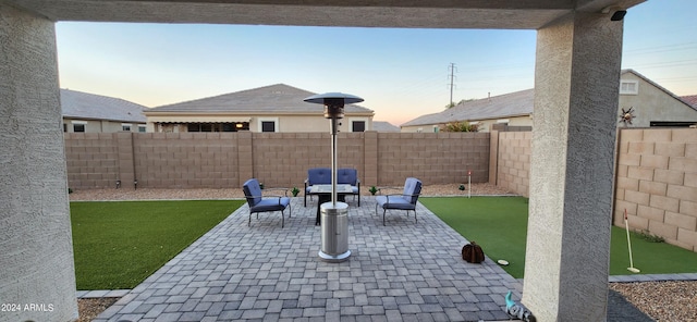 view of patio terrace at dusk