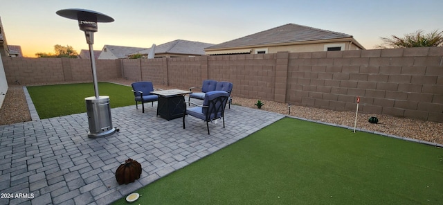 view of patio terrace at dusk