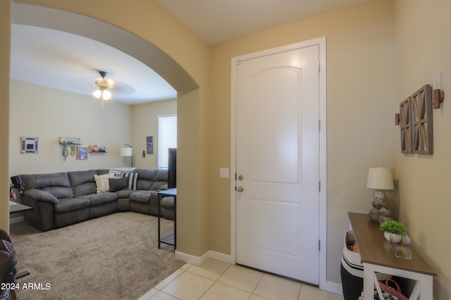 tiled foyer entrance with ceiling fan